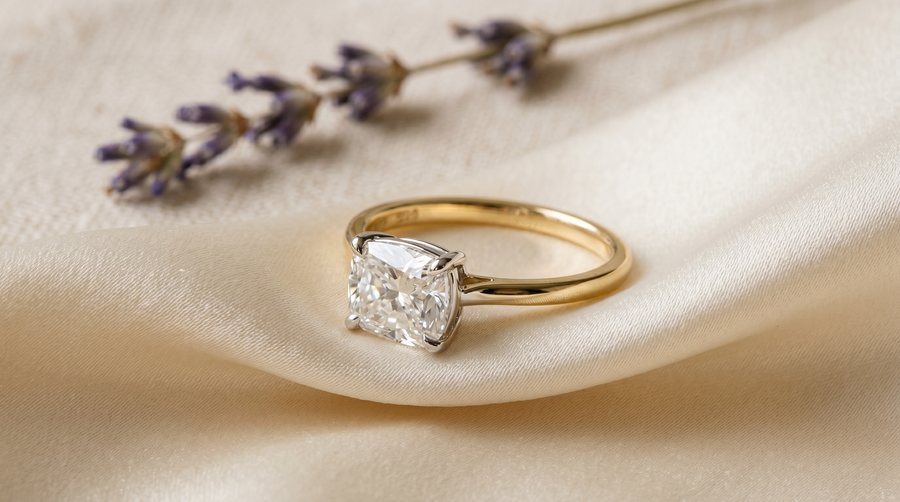 "Lab grown cushion cut diamond engagement ring with white gold setting and yellow gold band, east-west orientation, mixed metal Zendaya-inspired style"