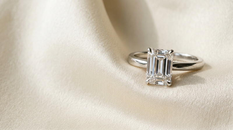 Emerald cut lab grown diamond engagement ring in platinum solitaire on cream silk — Mohana Jewels