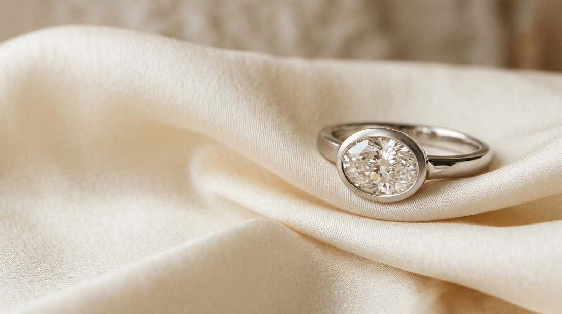 East-west set oval lab grown diamond engagement ring in 18k white gold bezel — Mohana Jewels