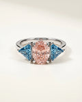 Ready to Ship 2 Carat Fancy Vivid Pink Oval Three-Stone Blue Trillion Diamond Ring — view 2