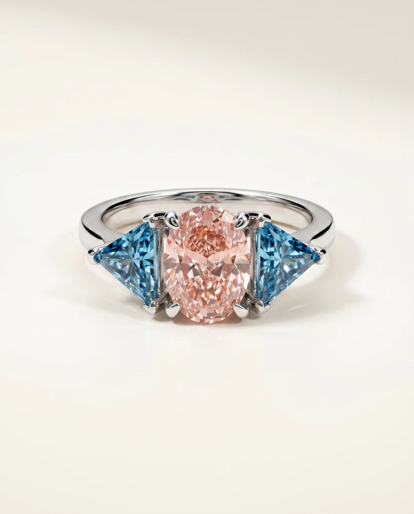 2 Carat Fancy Vivid Pink Lab Grown Diamond Engagement Ring · Oval Cut Three-Stone with Blue Trillions